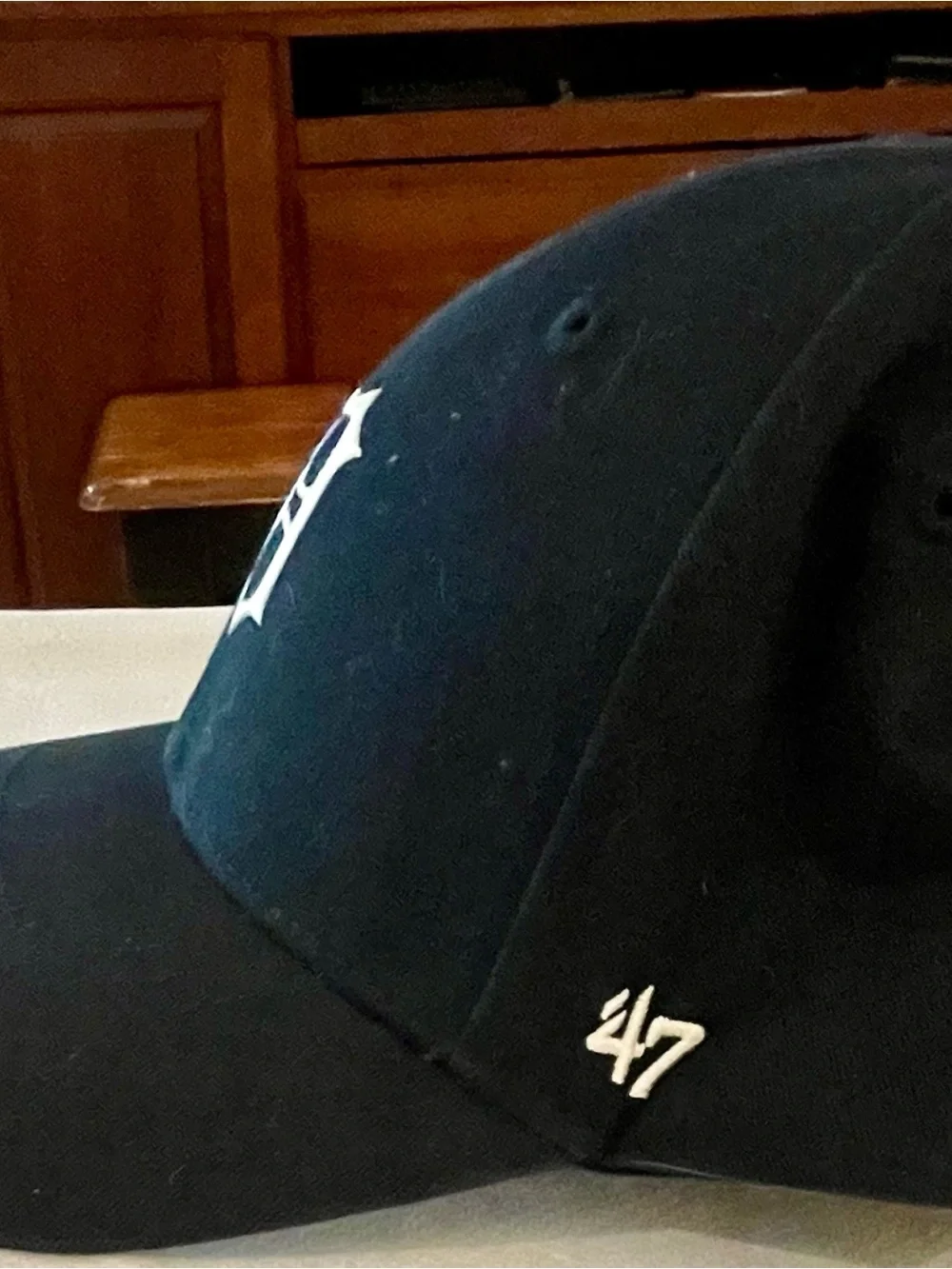 Genuine Merchandise Black Cap with White Logo Tag